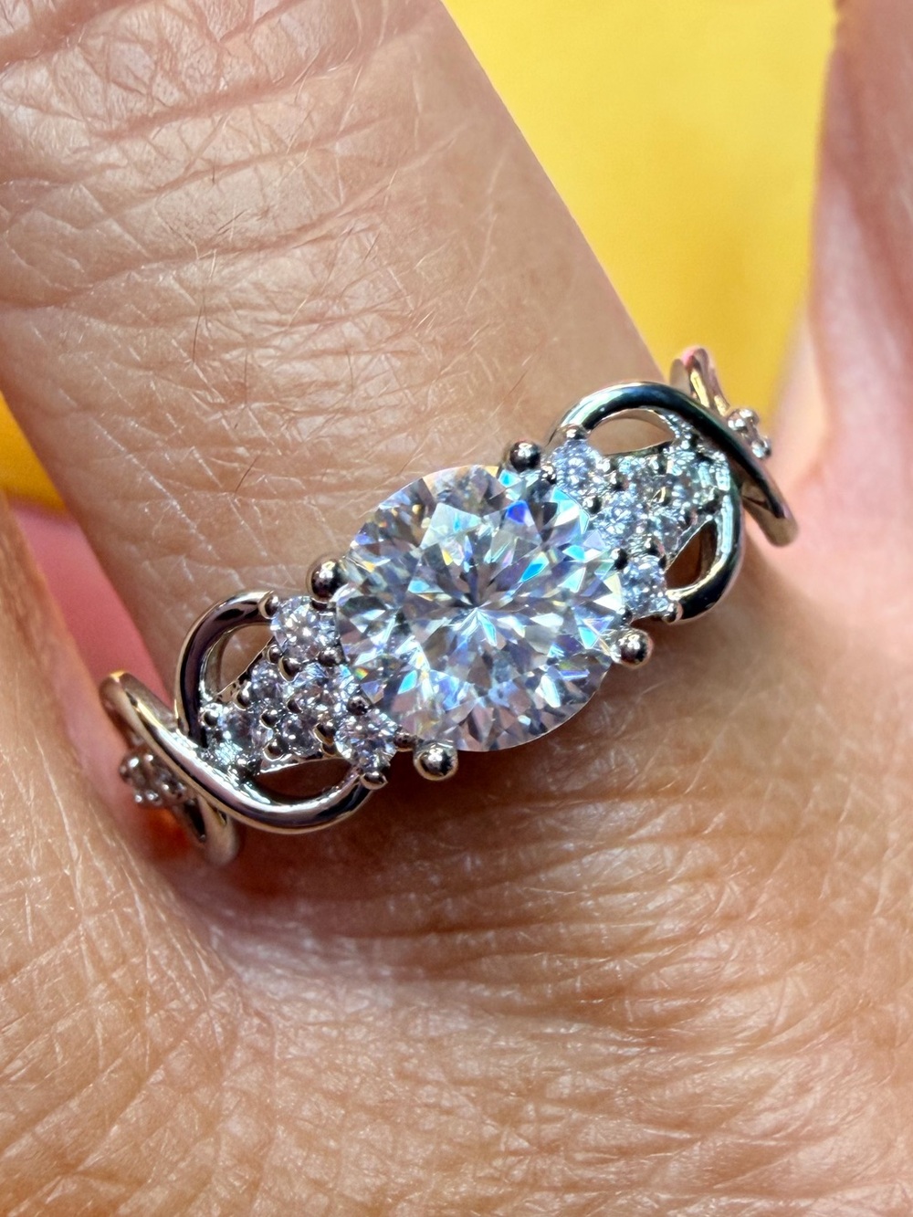 New 1 Carat Solitare Moissanite with accent side stones and intricate band